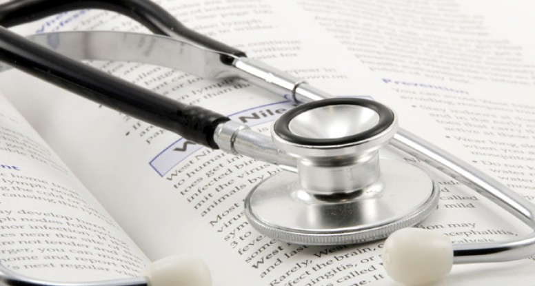 a stethoscope on the open book